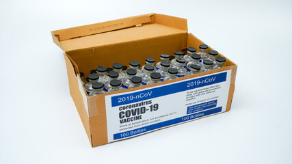 Covid-19 Corona Virus 2019-ncov SARS-CoV-2 vaccine medicine drug vials bottles syringe box. Vaccination, immunization, treatment to cure Covid 19 Corona Virus infection Concept. White background.