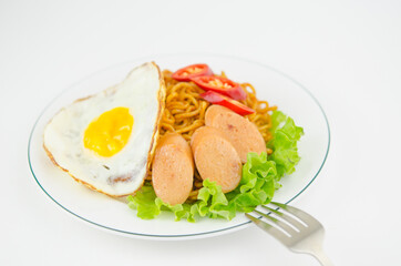 stir-fried instant noodles with omelet and sausage and lettuce