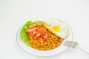 stir-fried instant noodles with omelet and sausage and lettuce