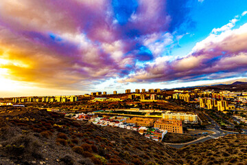 Suburb of the Canary Islands with a nice cloudy sky with forms and residential buildings