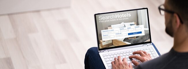 Man Booking Hotel On Website