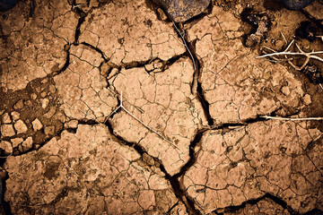 Dry drought cracked red earth and dirt from the sun and heat in Cape Verde  