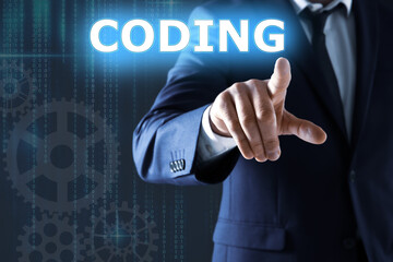 Businessman pointing at word CODING on virtual screen, closeup
