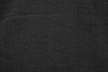 Close up of black jeans jacket fabric.