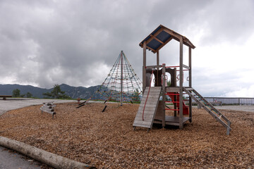 Empty new playground for children in the mountains