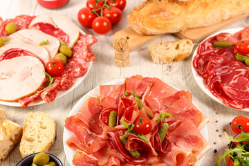 assorted of delicatessen, salami, bacon, ham with baguette