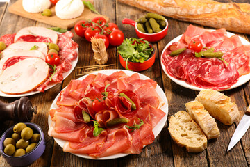 assorted of delicatessen, salami, bacon, ham with baguette