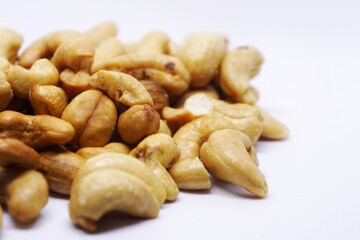 Close up of cashew nuts with white backgorund.
