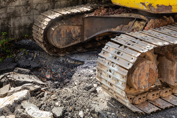 excavator loader machine at demolition construction site
