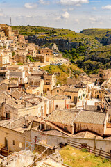 Fototapeta na wymiar It's Panorama of Matera, Puglia, Italy. The Sassi and the Park of the Rupestrian Churches of Matera. UNESCO World Heritage site