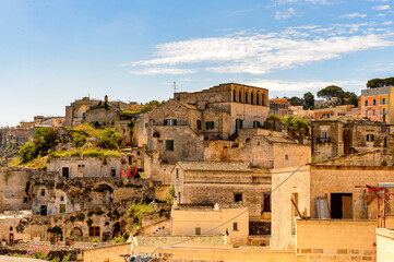 Fototapeta na wymiar It's Houses in Matera, Puglia, Italy. The Sassi and the Park of the Rupestrian Churches of Matera. UNESCO World Heritage site