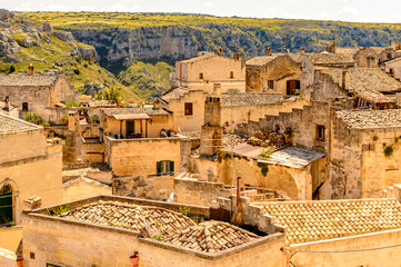 Obraz premium It's Houses in Matera, Puglia, Italy. The Sassi and the Park of the Rupestrian Churches of Matera. UNESCO World Heritage site