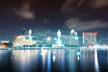 Fototapeta premium Glowing Social media icons on night panoramic city view of Singapore, Asia. The concept of networking and establishing new connections between people and businesses. Double exposure.