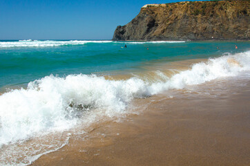 beautiful view of the beach coast of the Atlantic ocean in Portugal. Tourism and recreation. Waves break on the shore, banner.