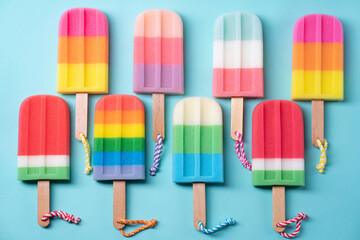 Sponge popsicle Pastel Colors on blue pastel background.