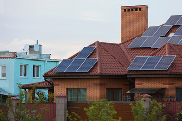 House with installed solar panels on roof