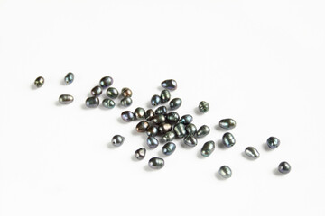 Group of black river pearl beads isolated on white background