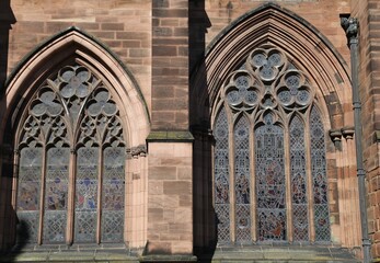Obraz premium An external view of the leaded, stained glass windows in a Church.