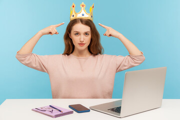 Look, I am boss here! Proud ambitious egoistic narcissistic businesswoman pointing at crown on head...