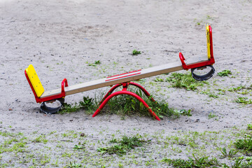 Lonely kids seesaw on the playground