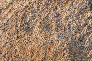 Mottled granite background used for kitchen worktop, table, window sill, fence. Red brown igneous rock stones texture. Text sign advertising design mockup. Architecture detail natural booth backdrop.