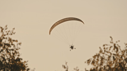 Paramotor Tandem Gliding And Flying In The Air. Copy space. High quality photo