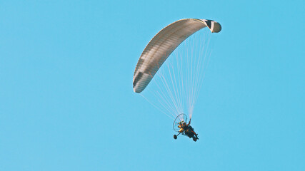 Paramotor Tandem Gliding And Flying In The Air. Copy space. High quality photo