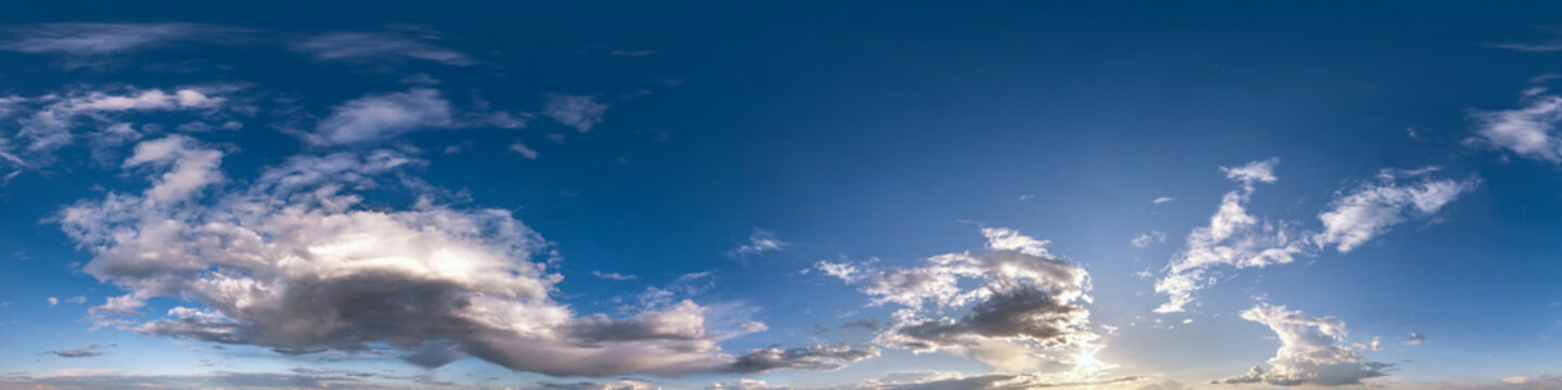 blue sky with beautiful fluffy cumulus clouds. Seamless hdri panorama 360 degrees angle view without ground for use in 3d graphics or game development as sky dome or edit drone shot