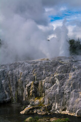 Fototapeta na wymiar Active geysers erupting above sulphur covered rocks