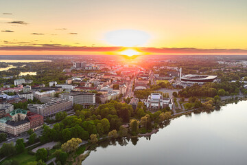 Aerial view of central Helsinki, Toolo bay and stadium, Finland. On the background beautiful sunset.