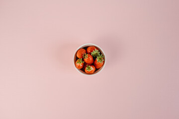 Flat Lay on Handful of Strawberries Lying on the Pink Background Table