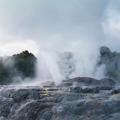 Fototapeta premium Active geysers erupting above rocks
