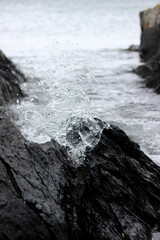 Waves crashing on rocks