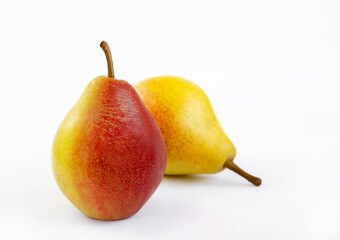 pear fruit, yellow fruits with red sides on a light background