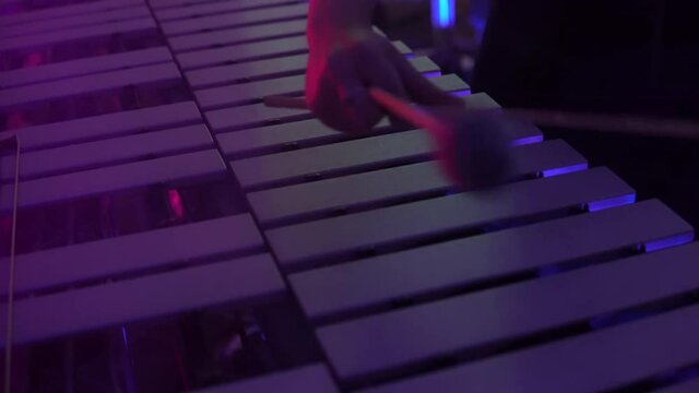 Artist performing music on vibrophone