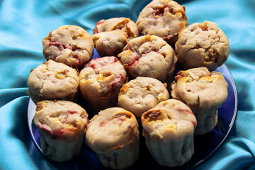 delicious berry cupcakes lie on a glass plate