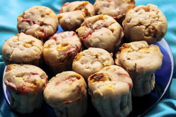 delicious berry cupcakes lie on a glass plate