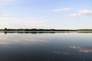 reflection of clouds in a blue lake