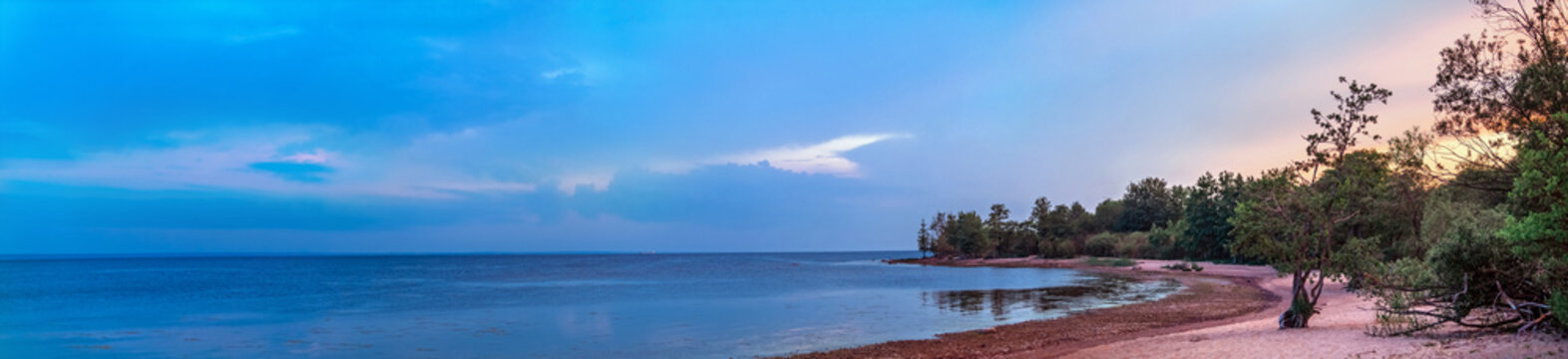 Panoramic view of the coast of the Gulf of Finland at sunset, Kotlin island, Russia