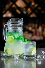 jug of refreshing lemonade with lime and ginger