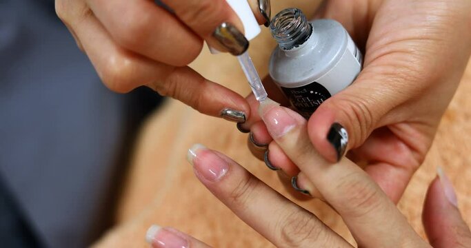 handheld shot, woman lifestyly of beauty manicure nail salon
