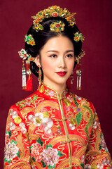 Asian ancient bride in red dress in big red background