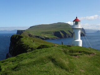 Fototapeta na wymiar Lighthouse on a small island of Mykines, Faroe islands