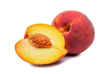 Whole and halved fresh peach showing the pip