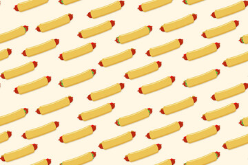Seamless pattern in light pink with pretzel dogs. For printing on fabric, packaging or as a backing on a street food web site