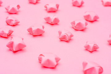 Solid pink background with paper stars in a children's style. Template for scrapbooking.