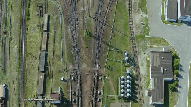 flight over the branches of railway tracks and a panoramic view of the large transport hub of the marshalling yard.