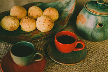 cup of tea and teapot on wooden table