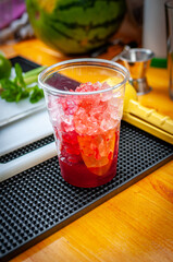 Preparation of cocktail. Adding ice, shaking ingredients and decorating with mint