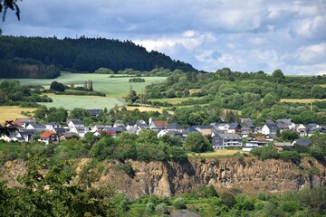 Fototapeta na wymiar Scenic landscape with village built at the edge of a cliff in the Eifel mountans, Germany